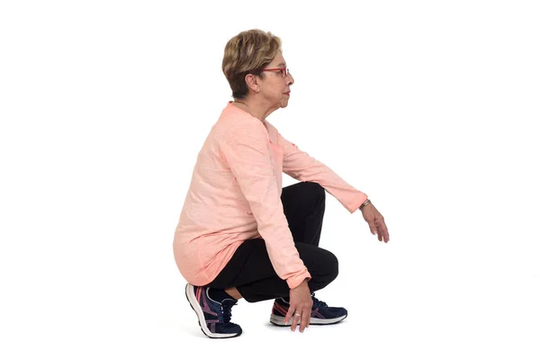 Side View Senior Woman Squatting White Backgrond — 스톡 사진