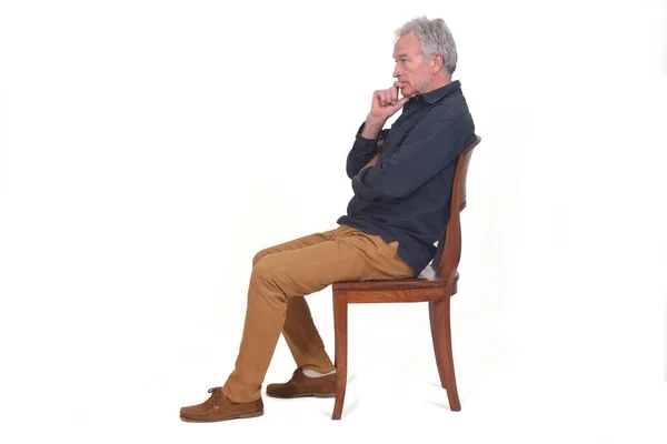 Side View Pensive Man Sitting Chair White Background — Stok fotoğraf