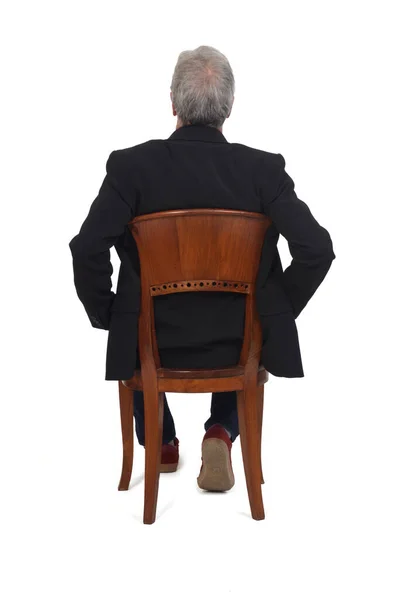 Rear View Man Sitting Chair Sneakers Jeans Blazer Arms Hip — Stock Photo, Image