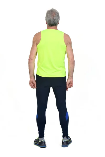 Baksida Bild Man Sportkläder Tights Och Fluorescerande Gul Vit Bakgrund — Stockfoto