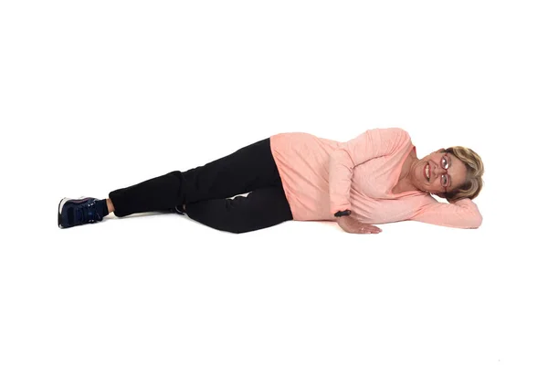 Woman Lying Floor Smiling Looking Camera White Background — 스톡 사진