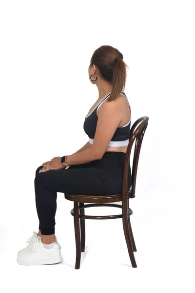 Full View Woman Sitting Chair Looking Backwards White Background — Stockfoto