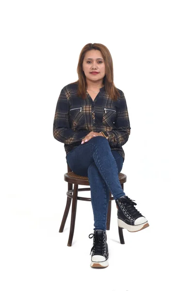 Front View Woman Sitting Chair Les Crossed Looking Camera White — Stockfoto