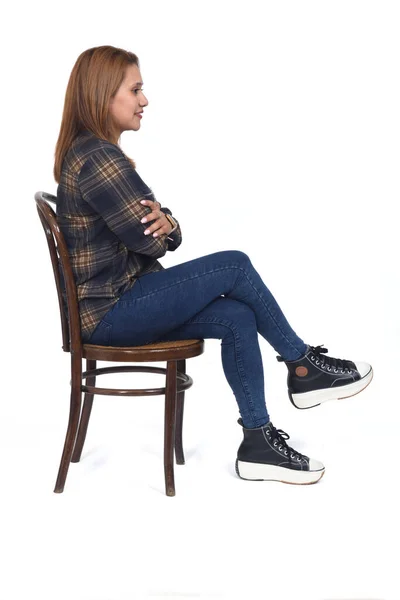 Side View Woman Sitting Chair Legs Arms Crossed White Background — Stok fotoğraf