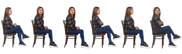Boční Pohled Stejné Ženy Sedí Židli Bílém Pozadí — Stock fotografie
