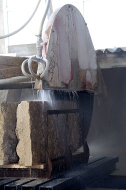 saw cutting a block of stone