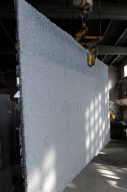 crane with a block of stone