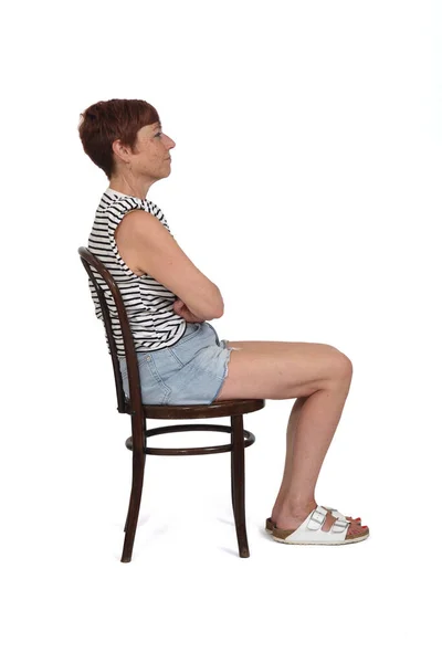 Middle Aged Woman Sitting Chair Serious Arms Crossed White Background — 스톡 사진