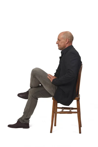 Side View Full Portrait Man Sitting Chair Cross Legged White — Stockfoto