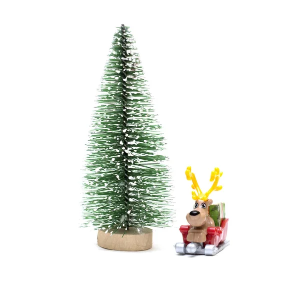 A toy tree with a deer in a sleigh. Feast of the Nativity of Christ. Isolated photo for design. — Stock Photo, Image