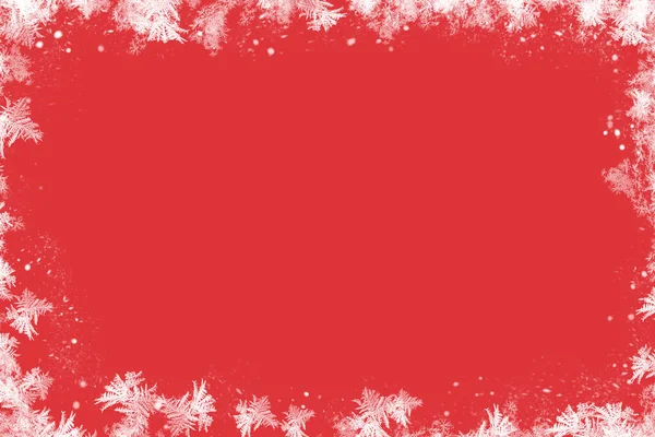 Christmas red background with decoration. Frost and sgenna red background. Winter.