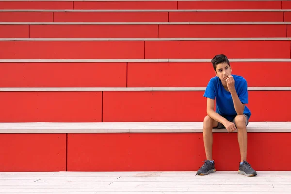 Shot Young Teen Boy Blue Shirt Siting Unhappy Something Red — Stock fotografie