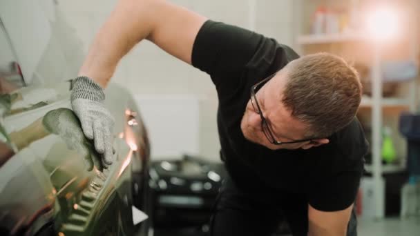 Close Shot Man Checking Vinyl Wrap Car Door Smoothing Vinyl — Stock Video