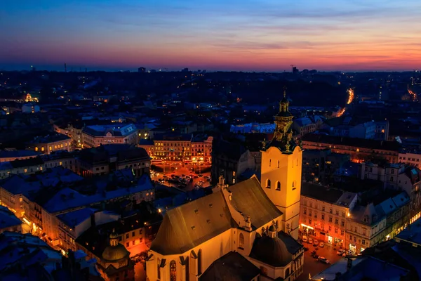 stock image Aerial night view of illuminated Latin cathedral and Rynok square in Lviv, Ukraine. View from Lviv town hall