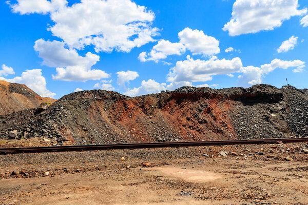 View of slag heaps of iron ore quarry. Mining industry