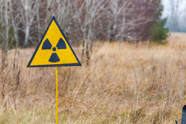 Radiation warning sign in Chernobyl Exclusion Zone in Ukraine