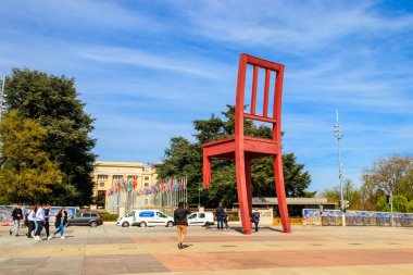 Geneva, Switzerland - April 11, 2022: Broken Chair Monument on Square of Nations in front of Palace of United nations building in Geneva, Switzerland. Dedicated to all victims of land mines. Artist Daniel Berset and Louis Geneve