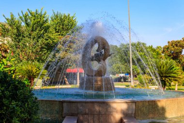 Fountain with dolphins in a park in Kemer, Antalya province, Turkey