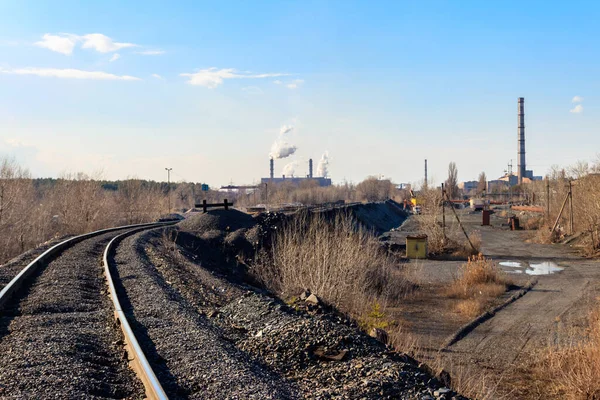 Railway tracks in the industrial zone with factories