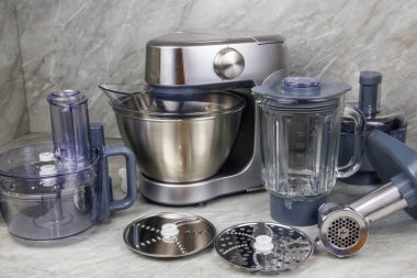 Modern kitchen machine with different attachments and accessories