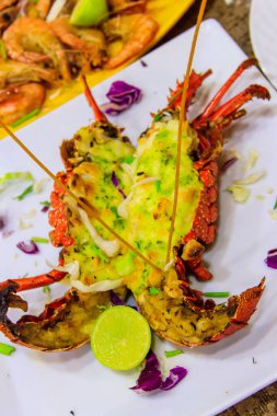 Delicious grilled lobster in a white plate in restaurant