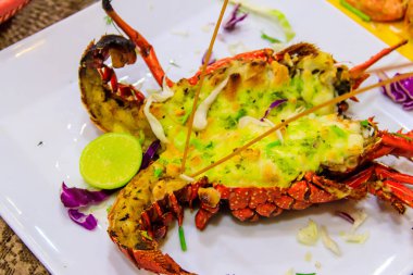 Delicious grilled lobster in a white plate in restaurant