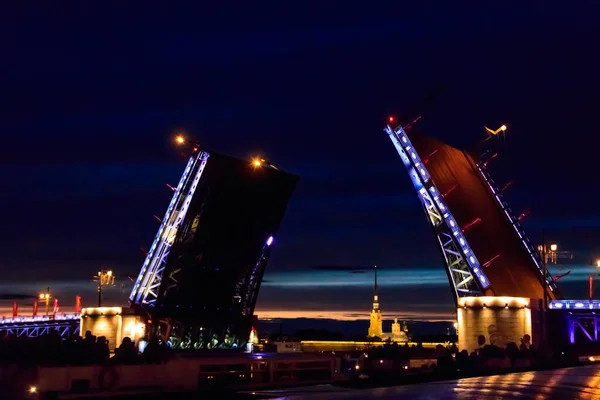 Opening of Palace drawbridge. Night view of Palace bridge from the Neva river in Saint Petersburg, Russia