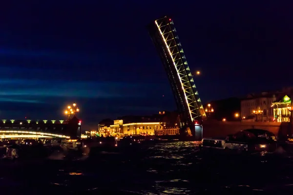 Opening of Trinity drawbridge. Night view of Trinity bridge from the Neva river in St. Petersburg, Russia