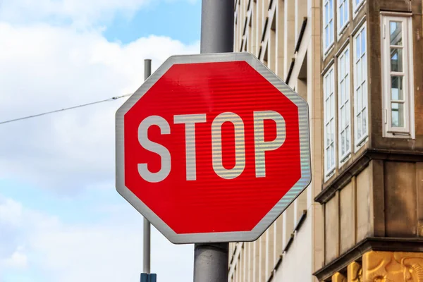 Red Stop sign on a city street