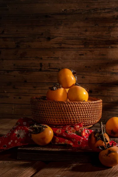 Persimmons Plate Wooden Table Dark Light — Foto Stock