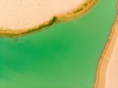 Emerald lake aerial view. Abstract fantasy green and yellow pattern background.