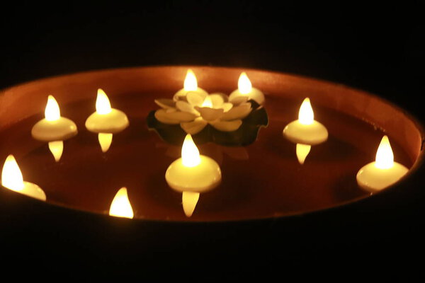 Beautiful Candlelight For Special Holidays. Candles in Water