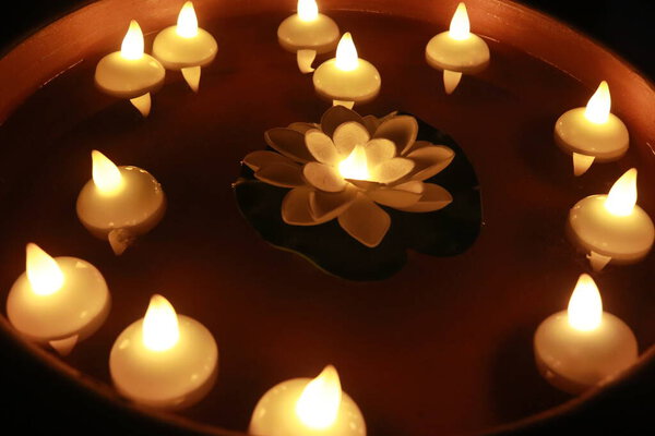 Candlelight For Special Holidays. Candles in Water. Reflection and Relaxation. Diwali Holidays