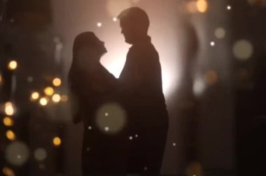 couple in the lights of love. Bokeh and Silhouettes. Love of both. He and She