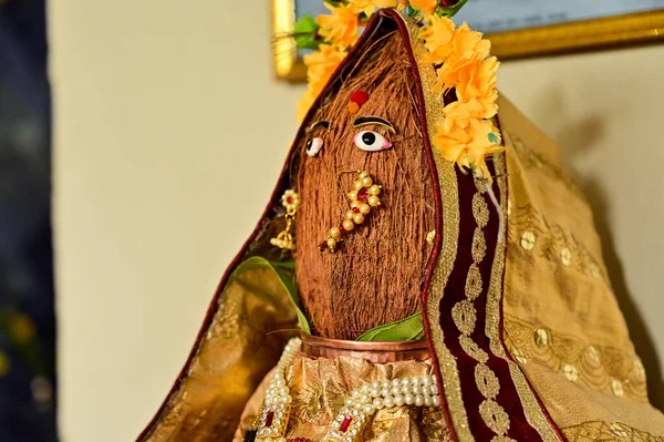 Coconut Face of Hindu Goddess. Indian Holidays and Festival. Flowers Decoration.
