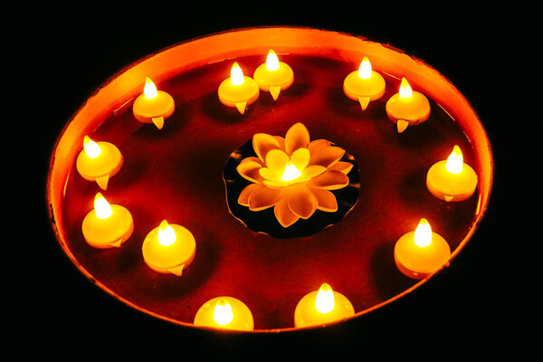 Burning Candle in Happy Home. Happy Diwali! Rangoli With Lights and Water. Family Special Event Holidays. Festival of Lights. Black Background