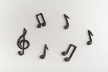 Three-dimensional black treble clef and music notes on white background. Violin key. Key of G. Music symbol