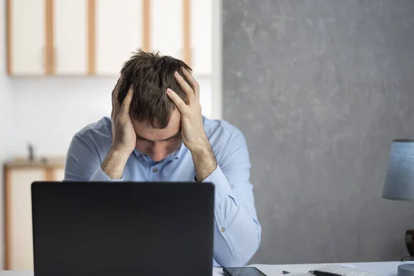 Young Man Businessman Works Laptop Tiredly Holds His Hands His — Stock fotografie