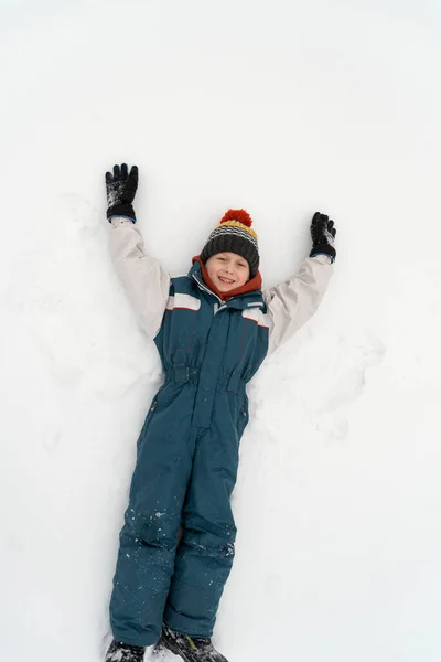 Funny Boy Ski Jumpsuit Lies Clear White Snow Child Makes — Stockfoto