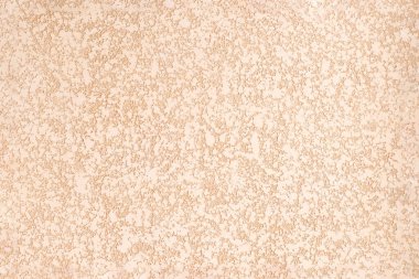 Sert alçılı yüzey. Heterojen dokuya sahip bej şeftali soyut arka plan