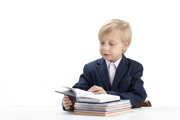 Blonde Schoolboy Sits Table Flips Textbook Boy School Uniform Reads — стоковое фото