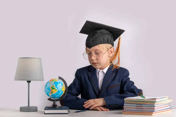 Portrait Boy School Uniform Students Hat Table Next Notebooks Globe — Zdjęcie stockowe