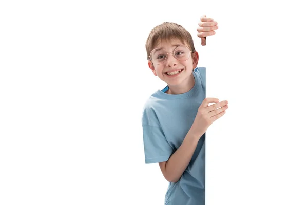 Joyful Cheerful Boy Peeks Out Whiteboard Empty Space Your Text — Stockfoto