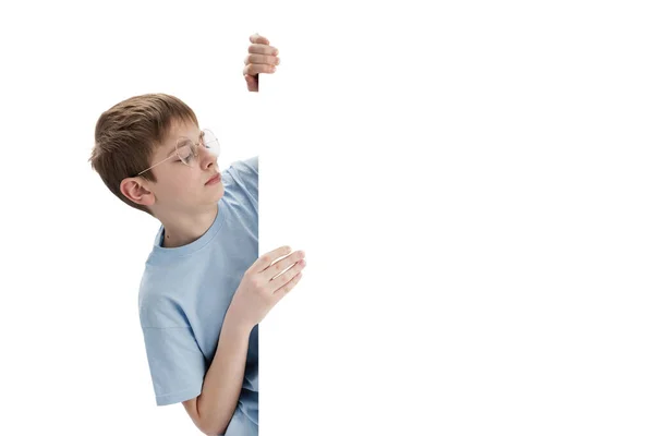 Young Caucasian Schoolboy Peeking Out White Blank Copy Space Boy — стоковое фото