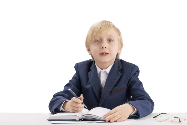 Blond Schoolboy Sits Desk Pen Listens Attentively Teacher First Grader — Fotografia de Stock