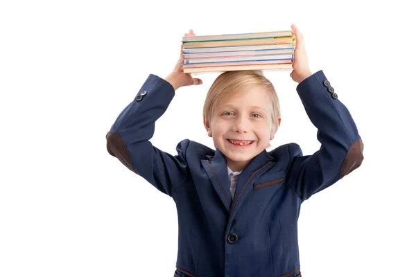 Glücklicher Blonder Schuljunge Schuluniform Hält Einen Stapel Bücher Auf Dem — Stockfoto