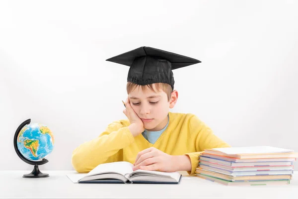 Schoolboy Wears Students Hat Does His Homework Bored Tired Boy — Stockfoto