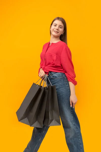 Portrait Young Attractive Girl Shopping Bags Yellow Background Black Friday — Zdjęcie stockowe