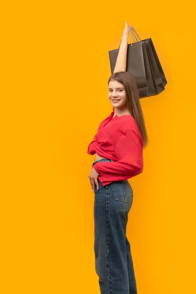 Happy Smiling Young Woman Black Shopping Bag Her Hands Yellow — ストック写真