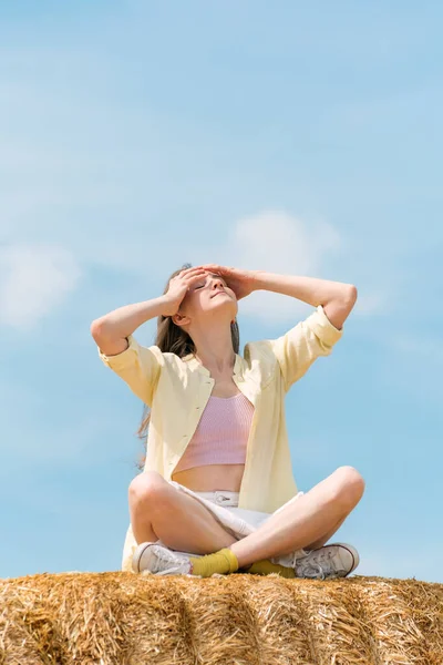 Young Woman Corrects Her Hair Girl Sits Hay Farm Summer — Stock fotografie